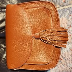 Tan Pebbled Leather Clutch with Tassel Detail Photographer Bag.